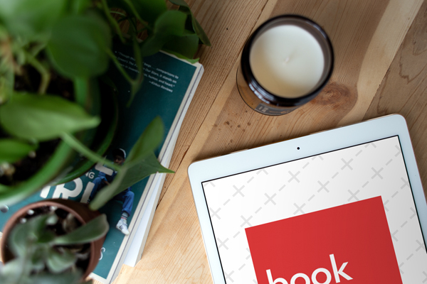 Close-up Mockup of White iPad on Wood Desk