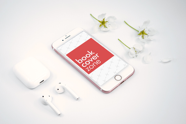 iPhone and AirPods Next to Flowers