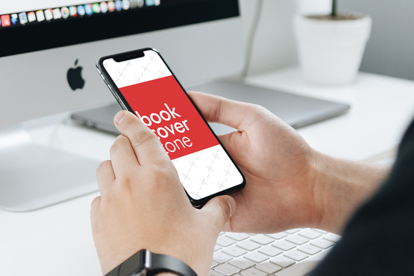 Mockup of Man Working on iMac and iPhone X