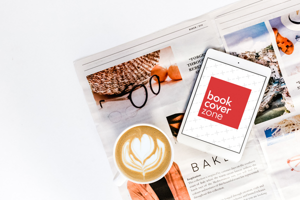Mockup of a White Tablet on Newspaper