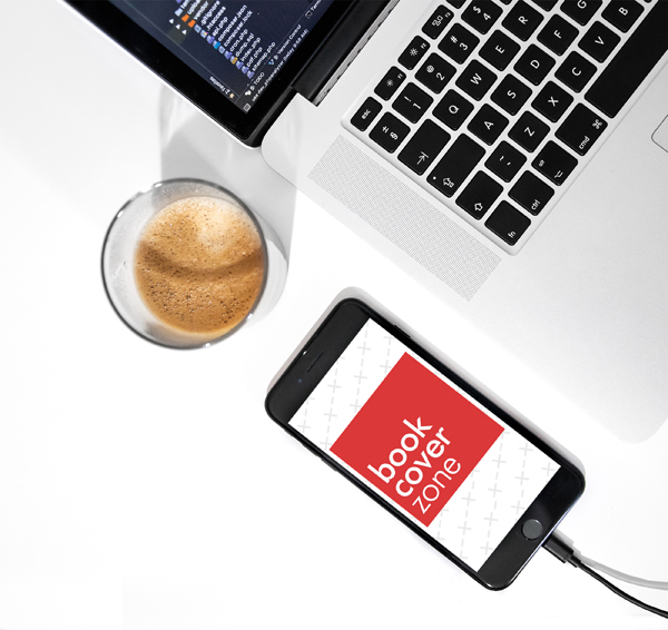 iPhone Charging Next to MacBook and Coffee