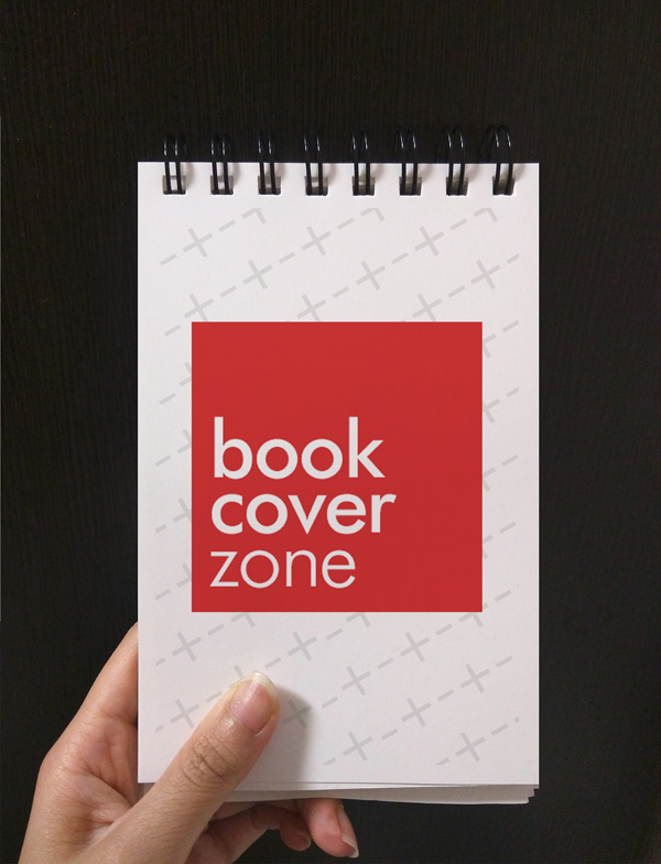Mockup of Person Holding Small Notebook