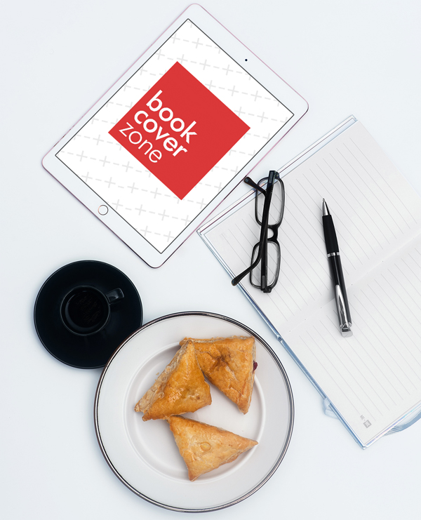 iPad on Desk with Pastries and Stationery