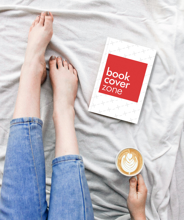 Woman Enjoying Coffee and a Book in Bed