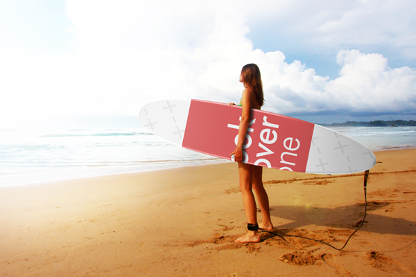 Woman on the Beach with Surfboard